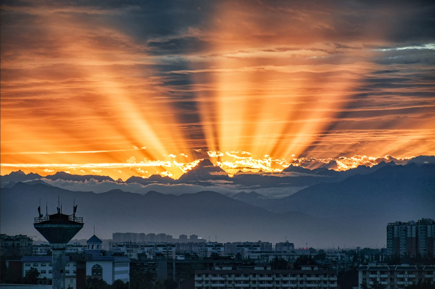 Chengdu skyline at sunset with mountains in the distance