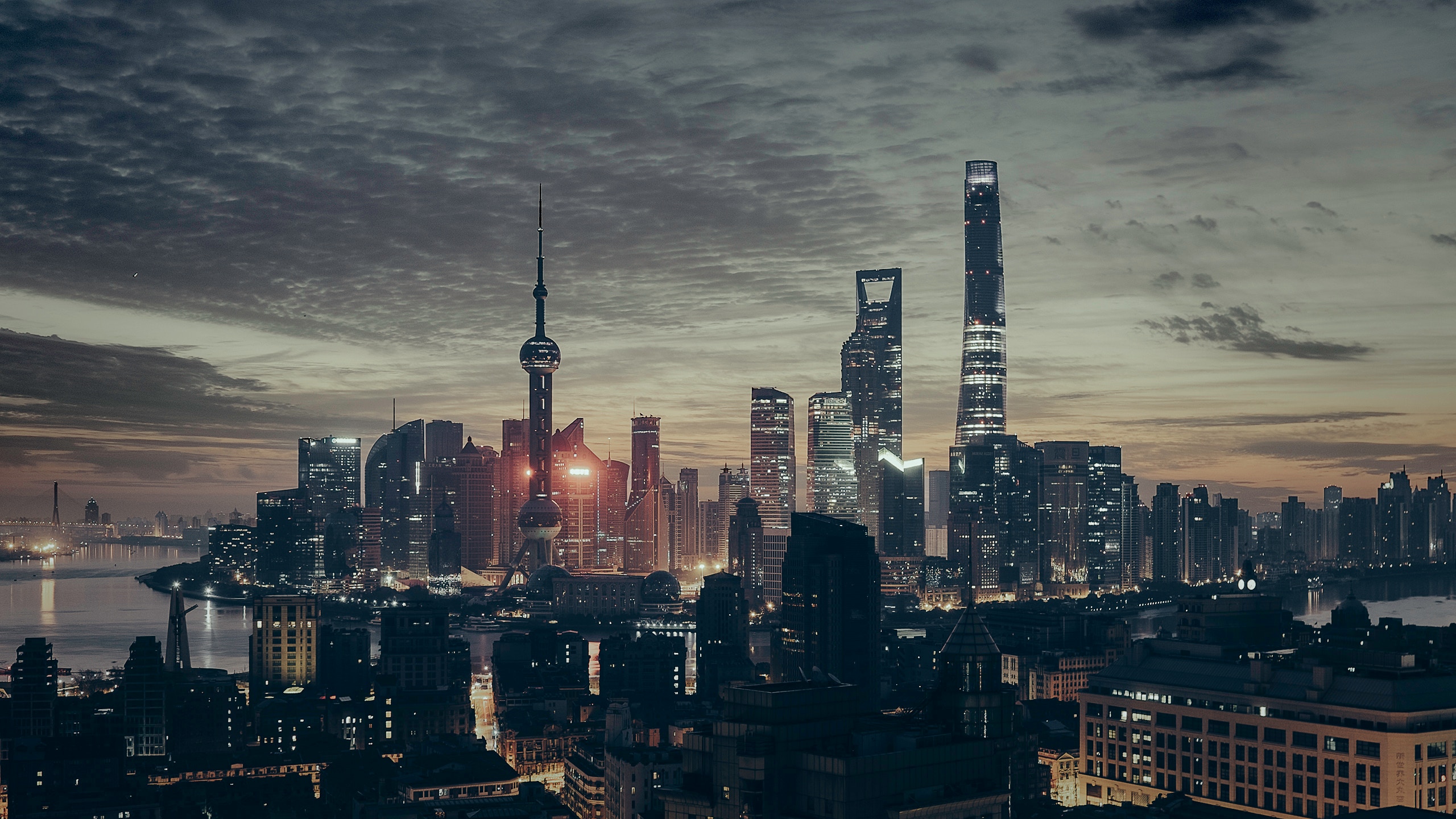 Shanghai Lujiazui skyline across the Huangpu River at dusk